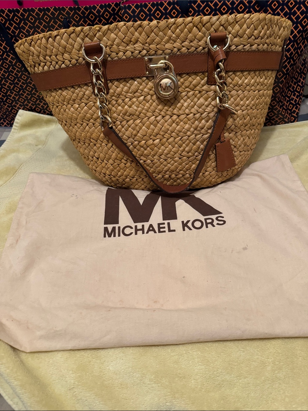 Michael Kors Straw Tote with Brown Leather Trim and Gold Hardware/Duster bag.